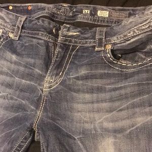 Miss Me jeans size 34/34 Unique blue and silver pocket design. Gently used.